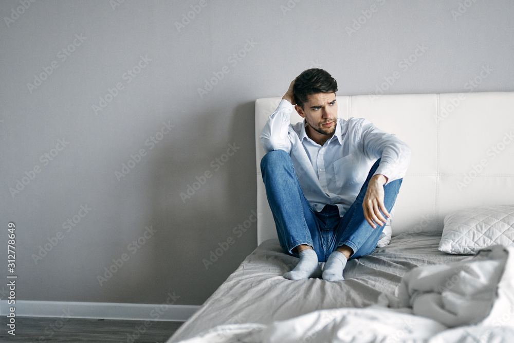 businessman sitting on sofa and looking at camera businessman sitting on sofa and looking at camera