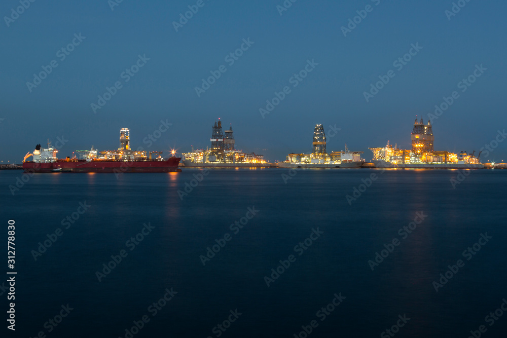 Panoramic view of oil platforms in the sea.
