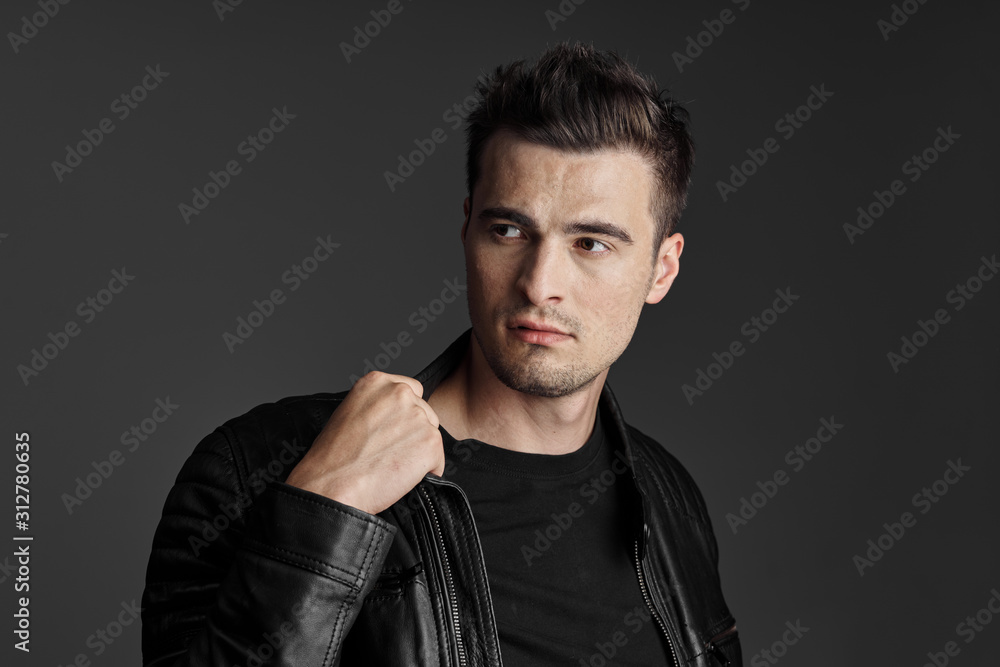Fototapeta premium portrait of young man with hands in pockets