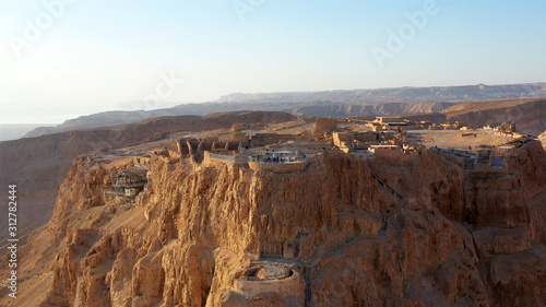 Drone View of Masada National Park at sunrise, Dead sea, Israel Masada - Aerial footage of the ancient fortification in the Southern District of Israel photo