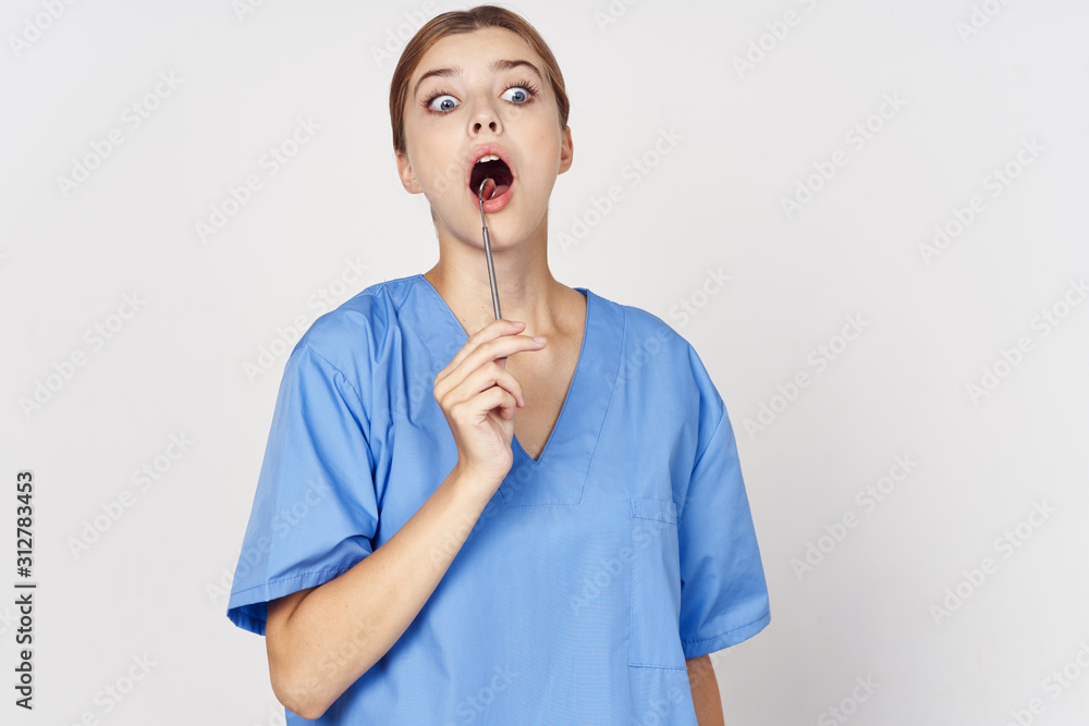 portrait of a young woman with finger on her lips portrait of a young woman with finger on her lips