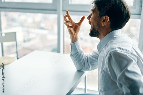 businessman looking at computer screen in office