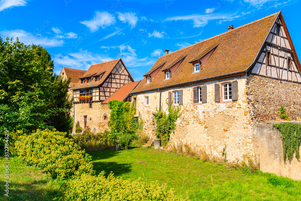 Beautiful traditional houses built from stones in Bergheim village, Alsace wine route, France