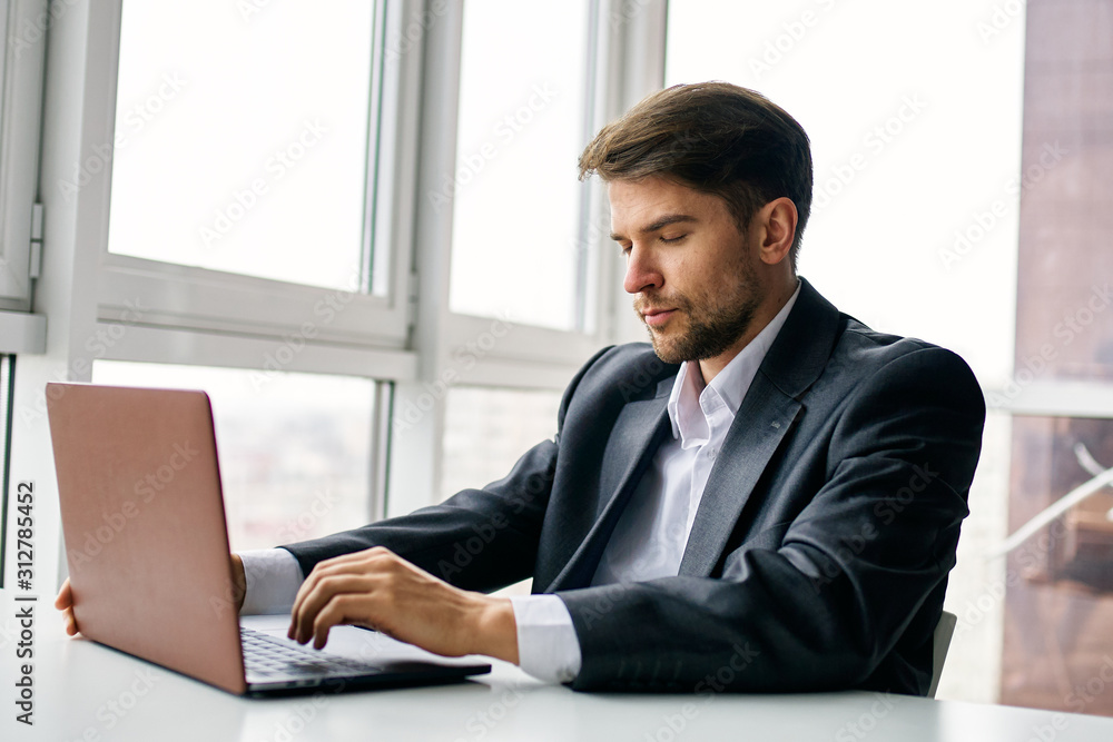 businessman working on laptop in office businessman working on laptop in office