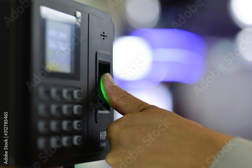 Businessman hand scanning finger on machine,Technology concept, Business concept,