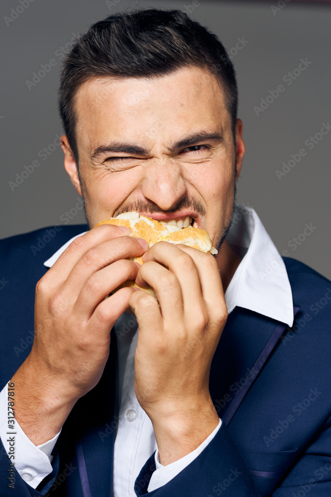 man eating hamburger man eating hamburger