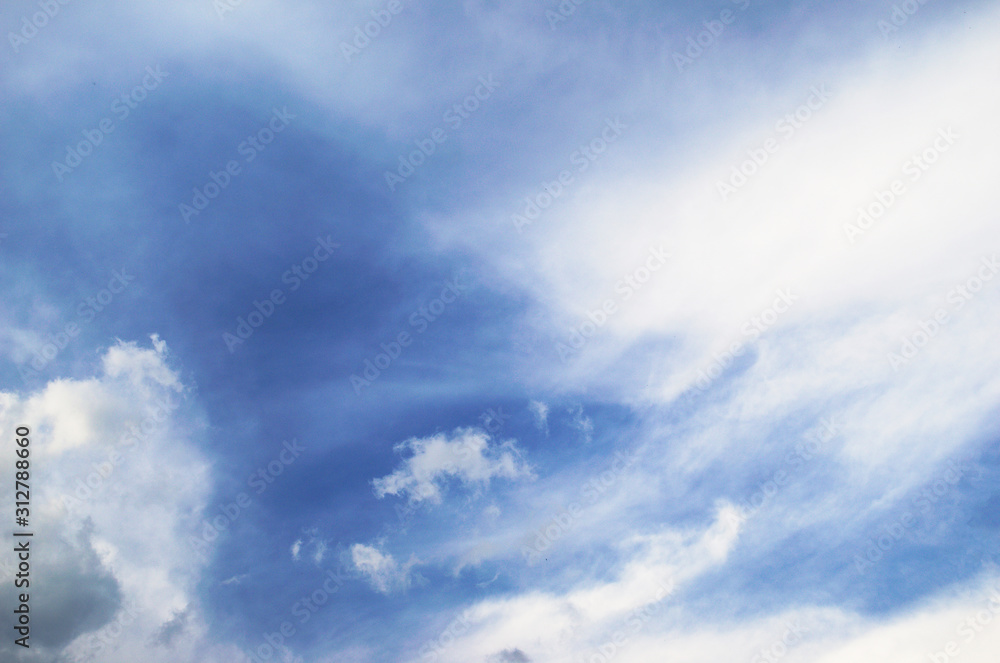 Fototapeta premium Blue sky and fluffy clouds. Beautiful cloudscape background. Sunlight on the clouds.