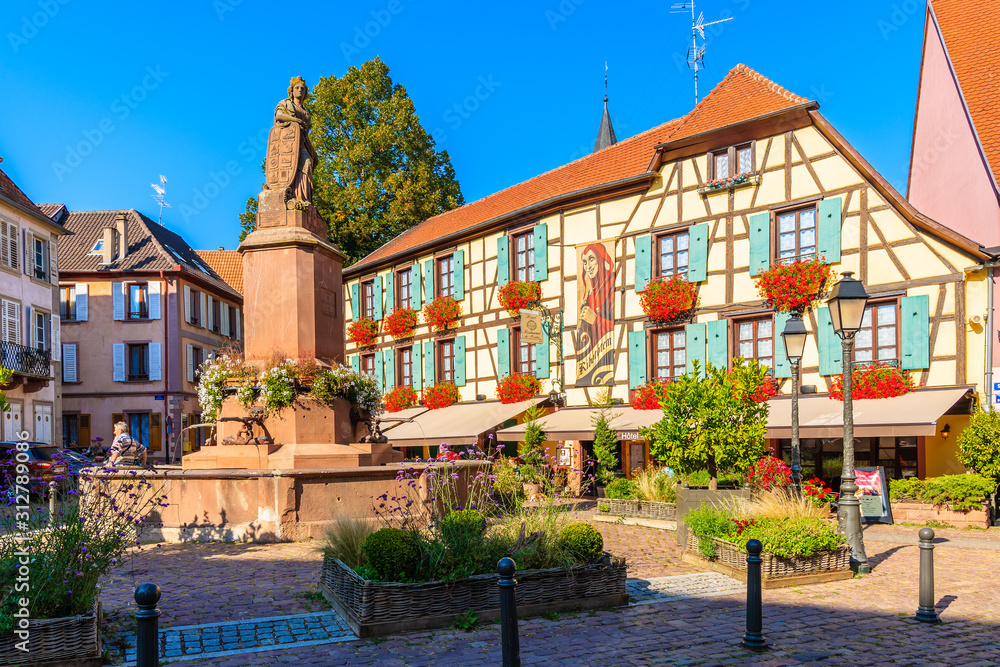 ALSACE WINE REGION, FRANCE - SEP 20, 2019: Restaurants and colorful houses on street of Ribeauville village which is located on Alsatian Wine Route, France.