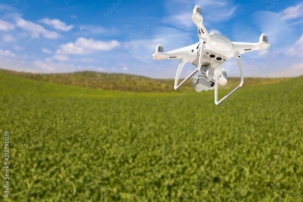 Drone Unmanned Aircraft Flying and Gathering Data Over Country Farmland Drone Unmanned Aircraft Flying and Gathering Data Over Country Farmland