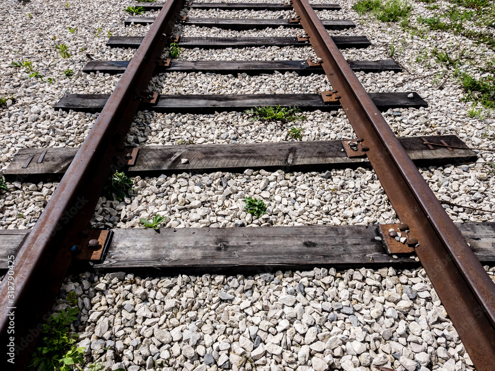 Close up image of empty railroad tracks go into the distance. Travel concept Close up image of empty railroad tracks go into the distance. Travel concept