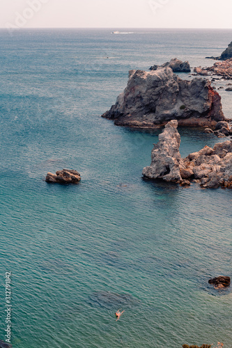 View on the seaside landscape Milos island at Paliochori beach at summer sun