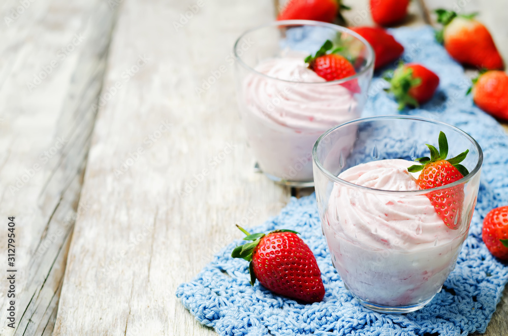 strawberry mousse on a dark wooden background strawberry mousse on a dark wooden background