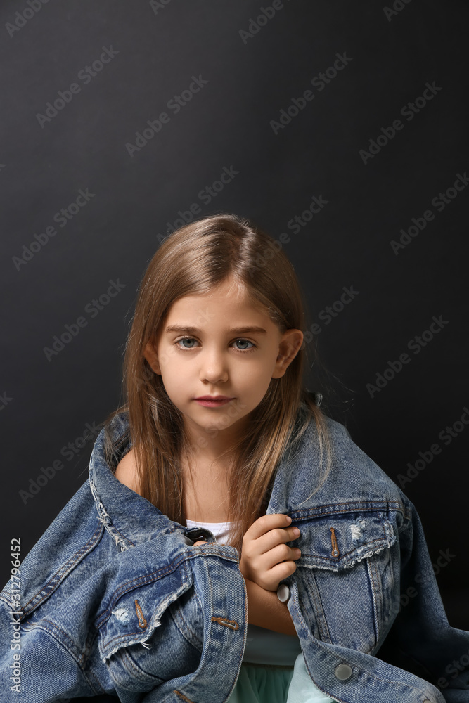 Cute little girl on dark background Cute little girl on dark background