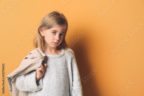 Cute fashionable girl on co...