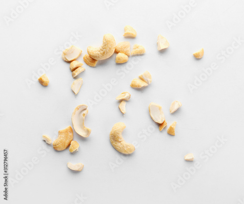 Tasty cashew nuts on white background