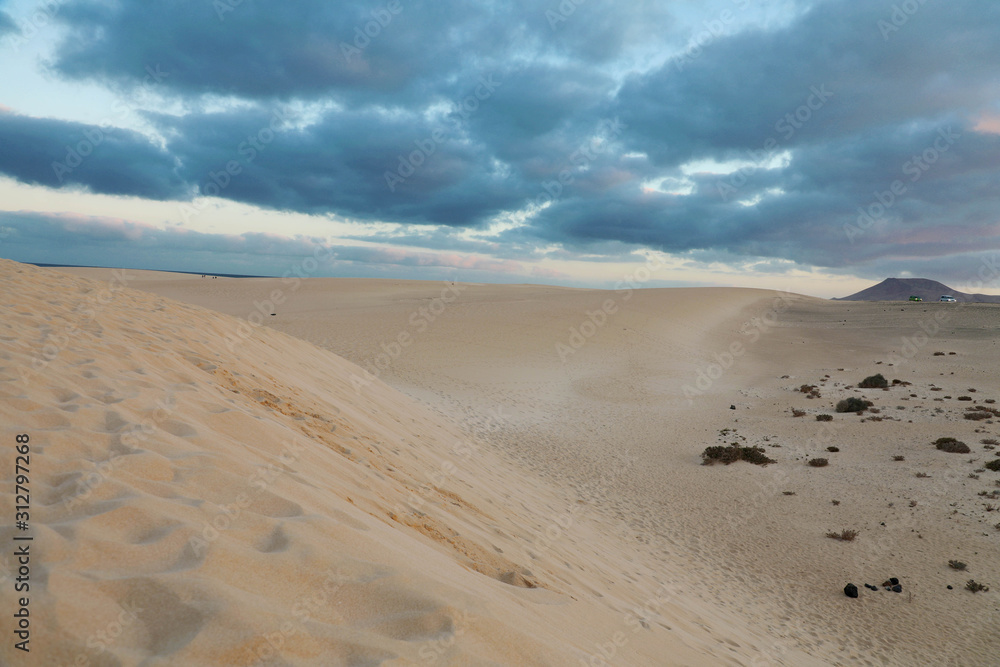 Dramatic sky sunset in desert, Corralejo Dunes in Furteventura, Canary Islands Dramatic sky sunset in desert, Corralejo Dunes in Furteventura, Canary Islands