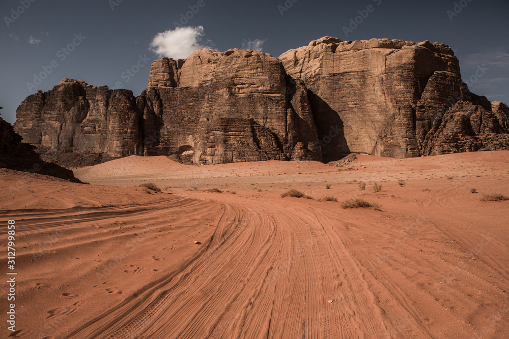 Wadi Rum Desert in Jordan. On the Sunset. Panorama of beautiful sand pattern on the dune. Desert landscape in Jordan. Wadi Rum Desert in Jordan. On the Sunset. Panorama of beautiful sand pattern on the dune. Desert landscape in Jordan.