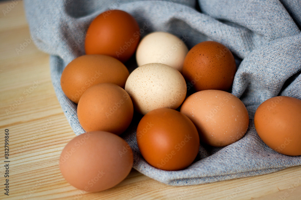 Whole and broken raw chicken eggs on a plate on a table yolk protein follows Easter eggs recipe food Whole and broken raw chicken eggs on a plate on a table yolk protein follows Easter eggs recipe food