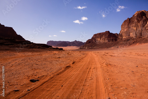 Wadi Rum Desert in Jordan. On the Sunset. Panorama of beautiful sand pattern on the dune. Desert landscape in Jordan.