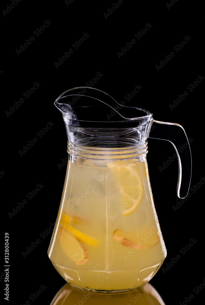 Pitcher with lemon lemonade and ginger Pitcher with lemon lemonade and ginger