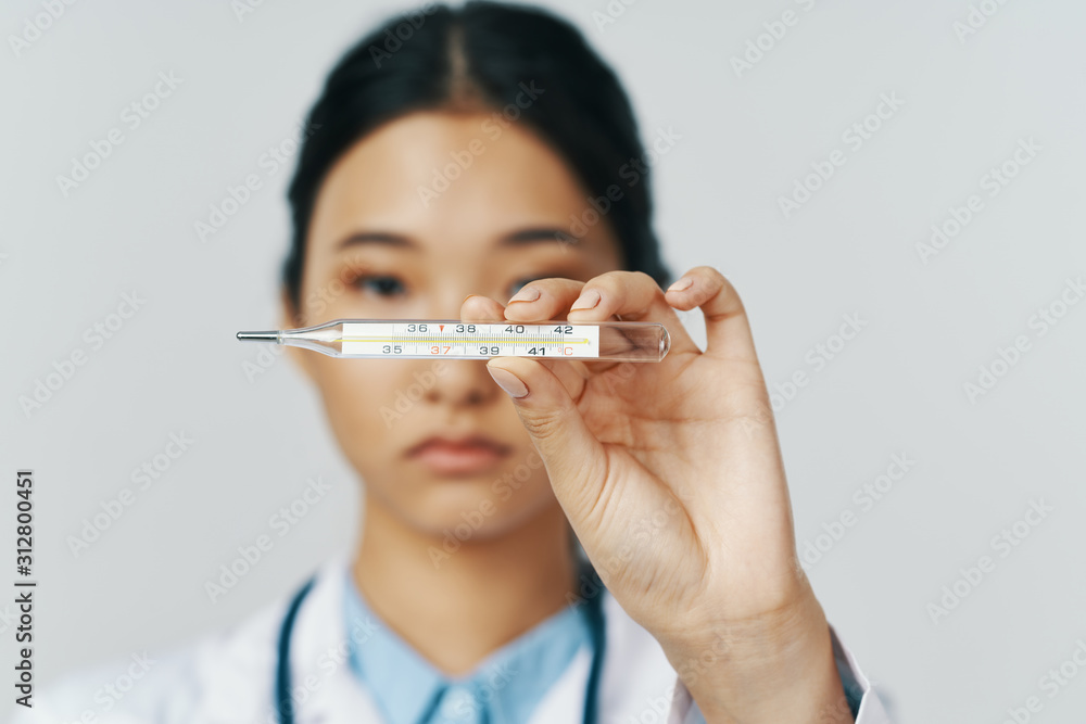 woman with thermometer in mouth isolated on white woman with thermometer in mouth isolated on white