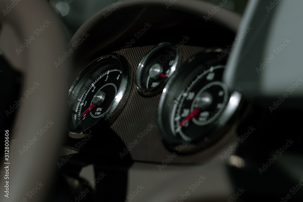 Steering wheel, speedometer, tachometer and trim level. Dashboard of a fishing boat