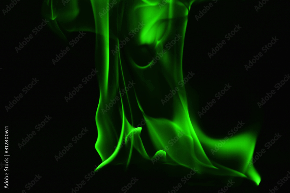 Beautiful fire green flames on a black background.