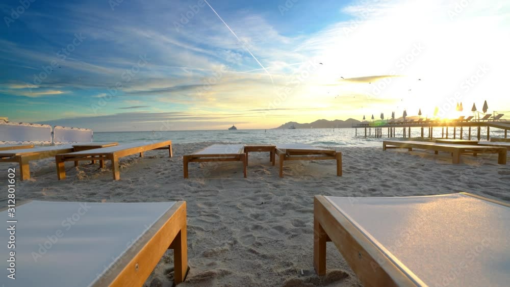 Luxury beach with empty chairs at sunset in Cannes, France Luxury beach with empty chairs at sunset in Cannes, France