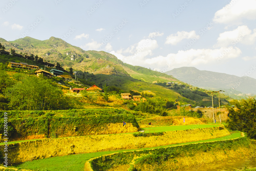 Y Linh Ho valley with rice terraces surrounded with mountains by Sapa, Vietnam 