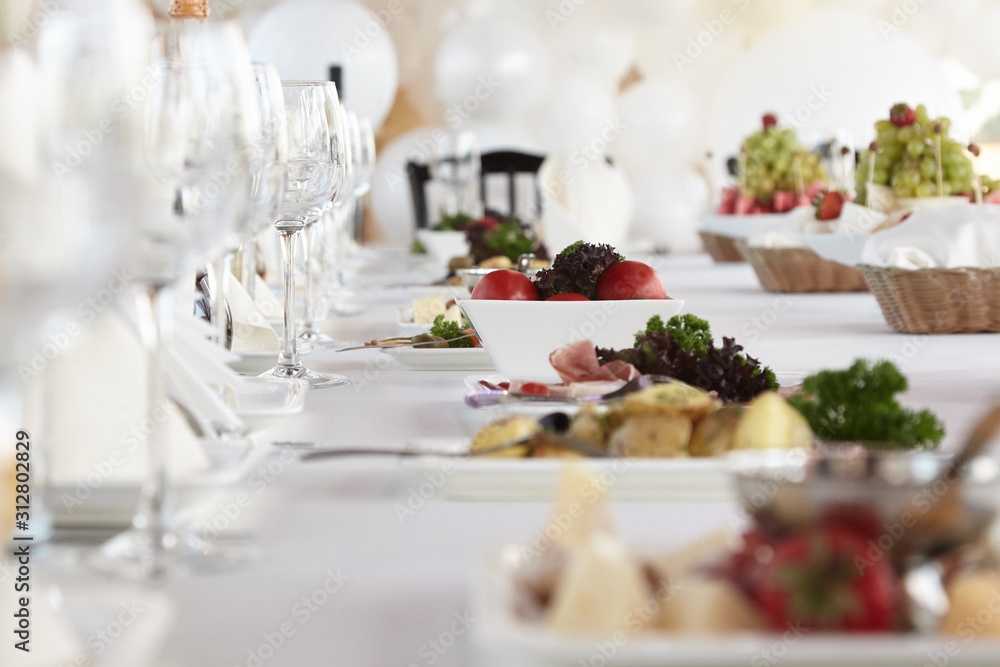 A luxurious covered table for the holiday in an expensive restaurant. A luxurious covered table for the holiday in an expensive restaurant.