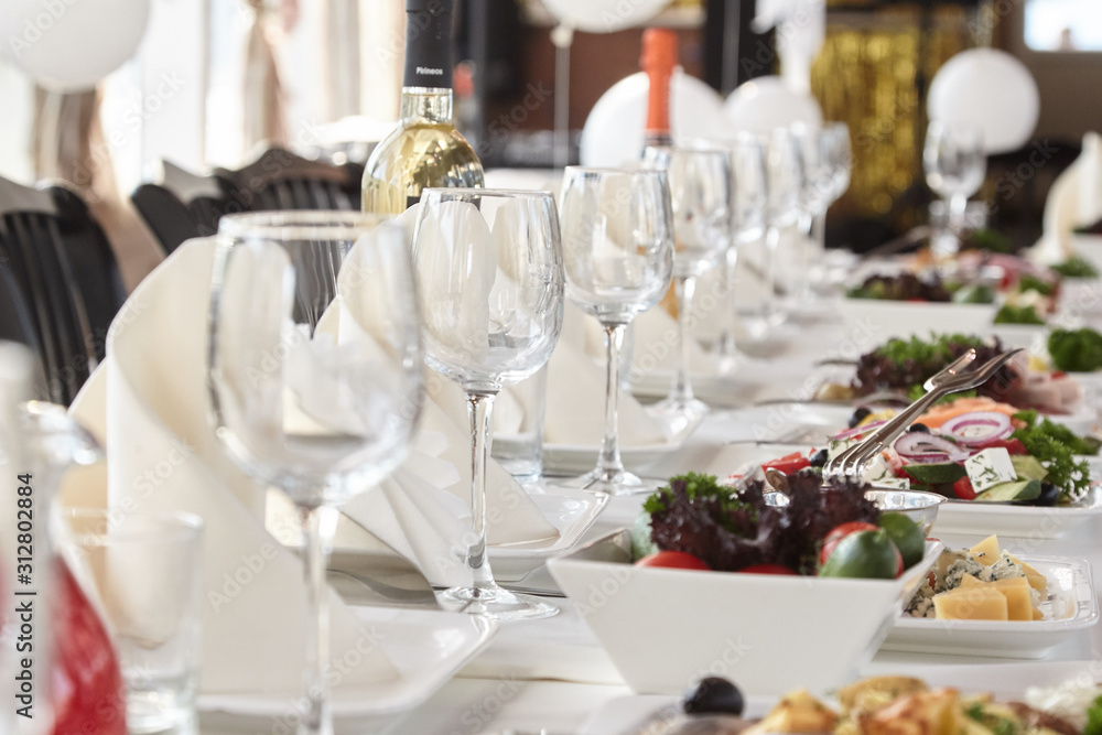 A luxurious covered table for the holiday in an expensive restaurant.	