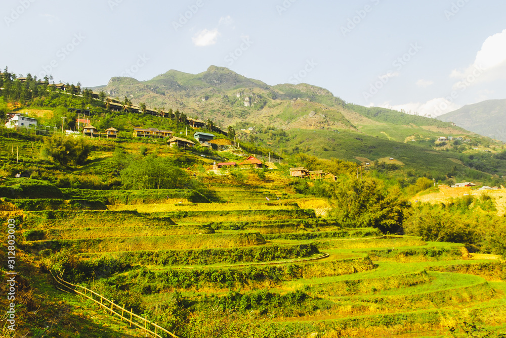Panoramic view of Y Linh Ho valley with rice terraces surrounded with mountains by Sapa, Vietnam Panoramic view of Y Linh Ho valley with rice terraces surrounded with mountains by Sapa, Vietnam