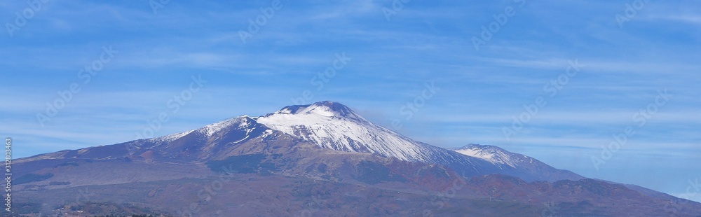 Etna volcano covered in snow. View from afar. Italy