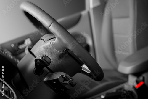 Interior of car. Car seats for driver and passenger. Steering wheel. © sandipruel