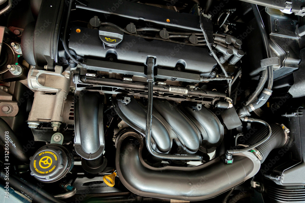 New car engine. Car hood open. Automotive industry. New car engine. Car hood open. Automotive industry.