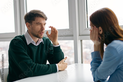 man and woman talking on the phone