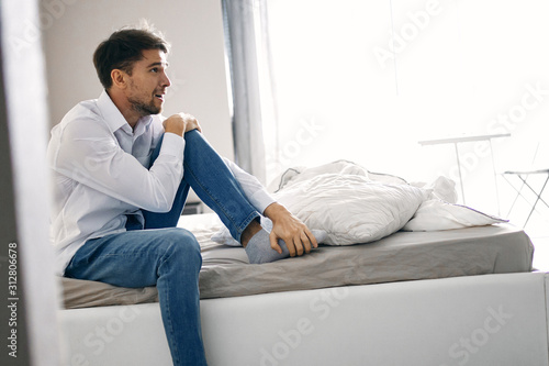 businessman sitting on sofa and working on laptop