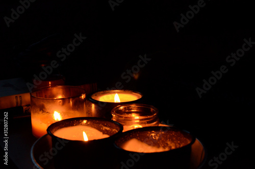 assorted candles against black backdrop