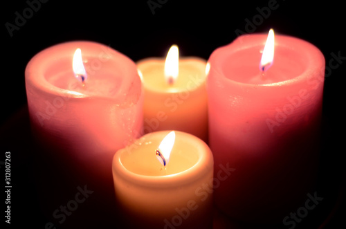 assorted candles against black backdrop