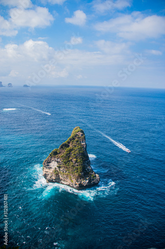 Banah Cliff Sunset View Point With Rock Outcrops and Islands In The Rich Blue Ocean of Nusa Penida, Bali, Indonesia photo