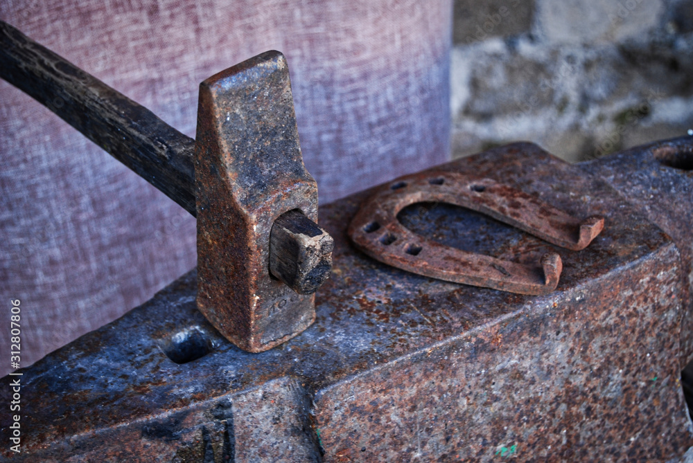 Hammer and anvil in a blacksmith's workshop Hammer and anvil in a blacksmith's workshop