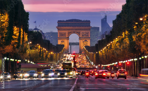 Champs Elysees and Arc de Triomphe in Paris France. night scene with car traffic