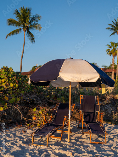 chairs and umbrella on tropical beach