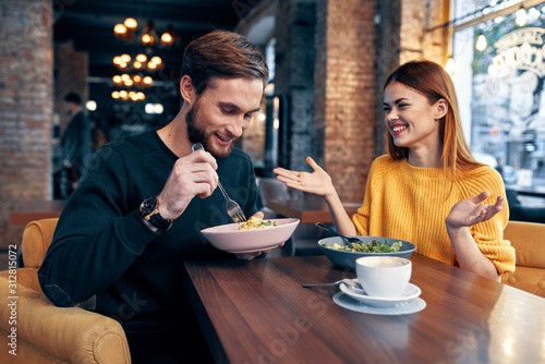 young couple having dinner in restaurant