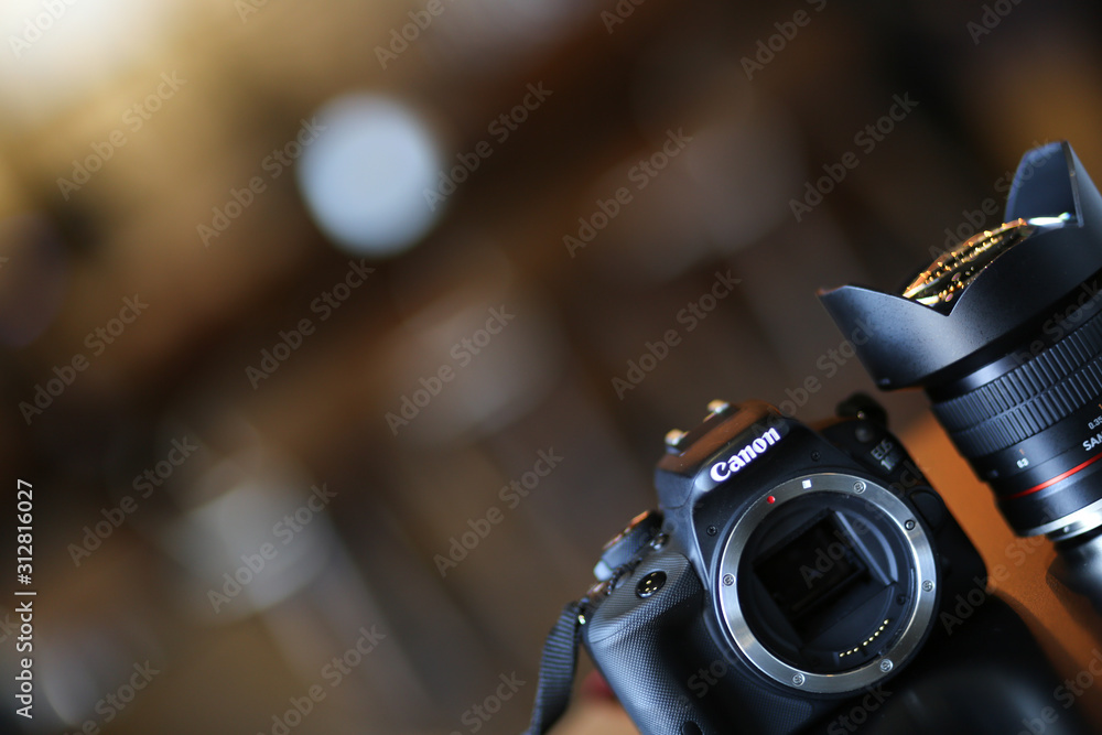 Professional Canon DSLR camera with Samyang ultrawide lens on a table Stock Photo | Adobe Stock Professional Canon DSLR camera with Samyang ultrawide lens on a table Stock Photo | Adobe Stock