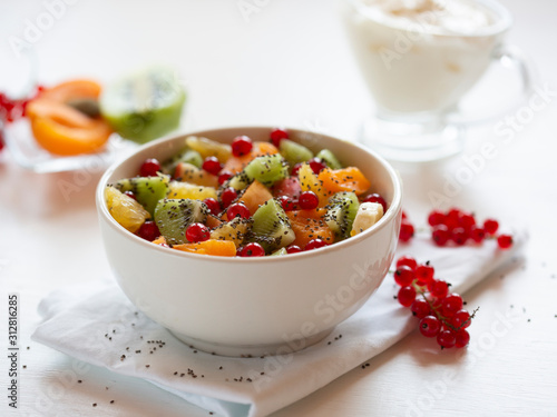 .Diet, healthy fruit salad in a white bowl-healthy Breakfast, weight loss concept.