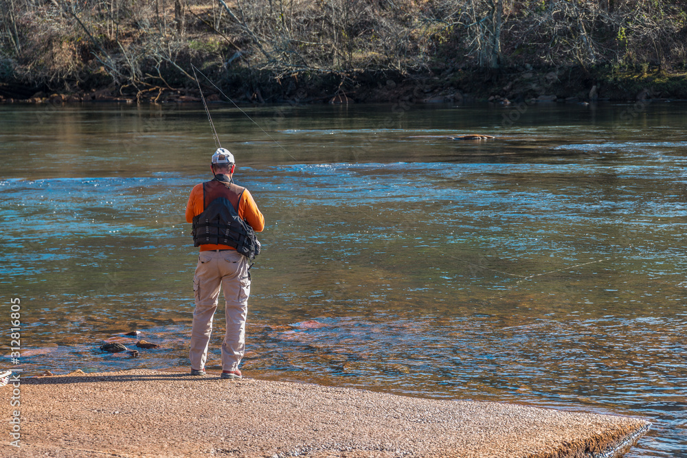 Man fishing at a river Man fishing at a river