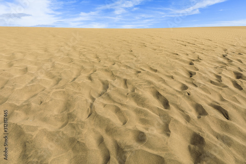 Sand in the Dunes of Maspalomas, a small desert on Gran Canaria, Spain. Sand and sky.