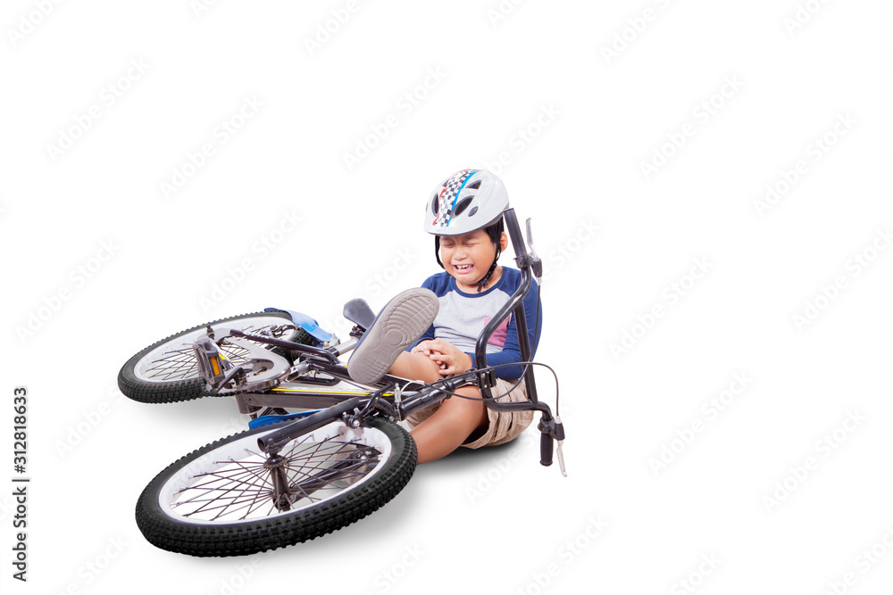 Boy crying because of his knee after crashing Boy crying because of his knee after crashing