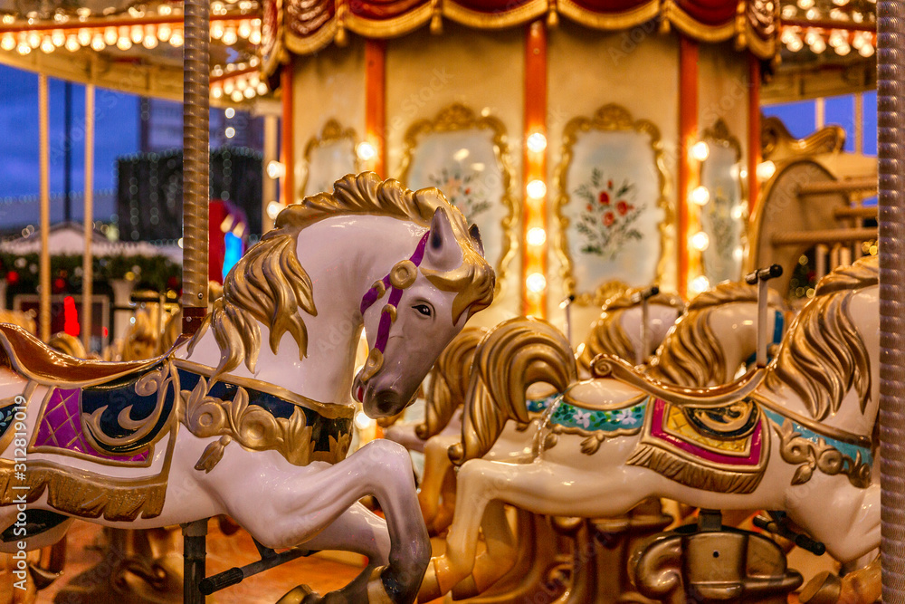 New Year's festive empty carousel with festive illumination. Close-up.